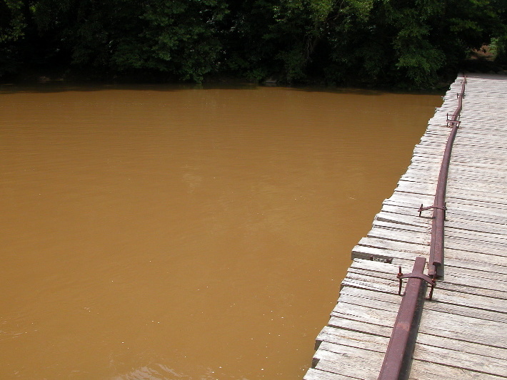 Old Leatherwood bridge across swollen Big South Fork. 