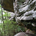 Cable on trail around rock outcrop. 