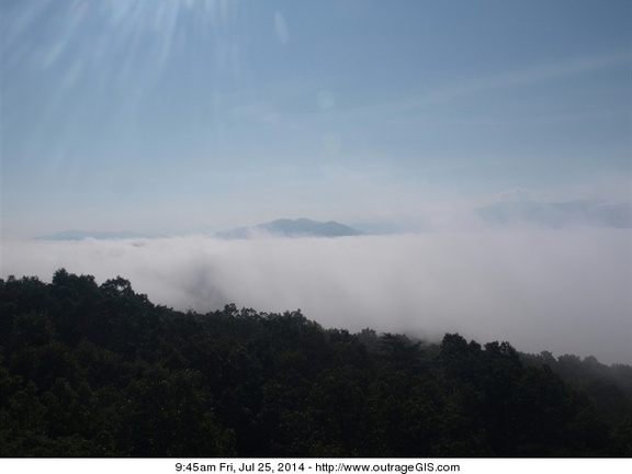Morning fog rises
