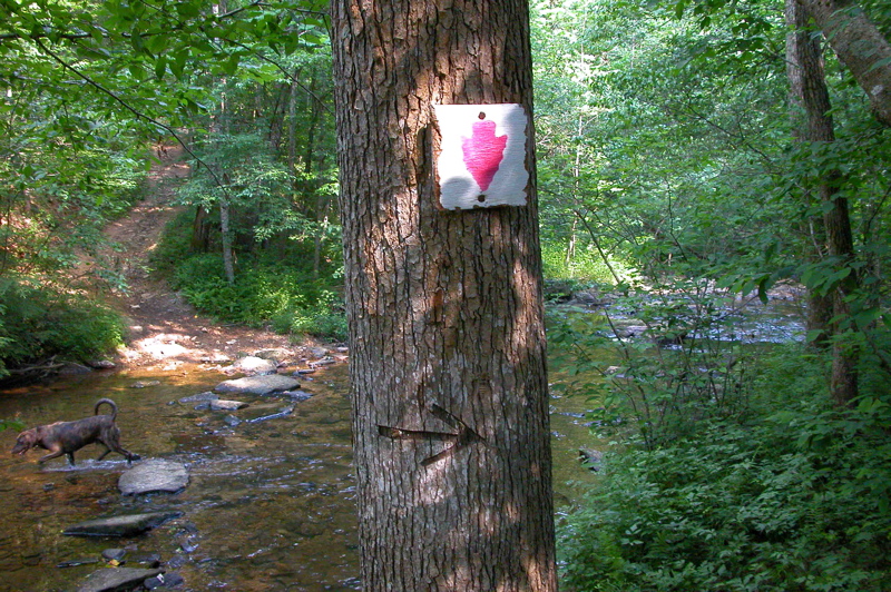 Historic, obsolete trail sign (replaced with plastic signs).