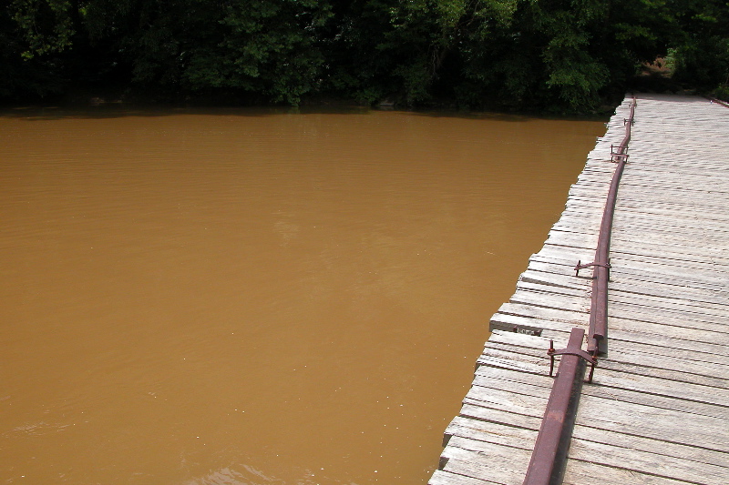 Old Leatherwood bridge across swollen Big South Fork. 