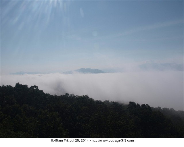 Morning fog rises